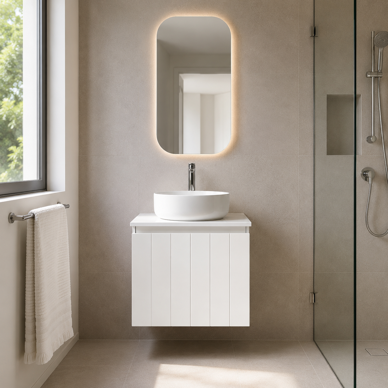 Bathroom with a white vanity unit, sink, and illuminated mirror.
