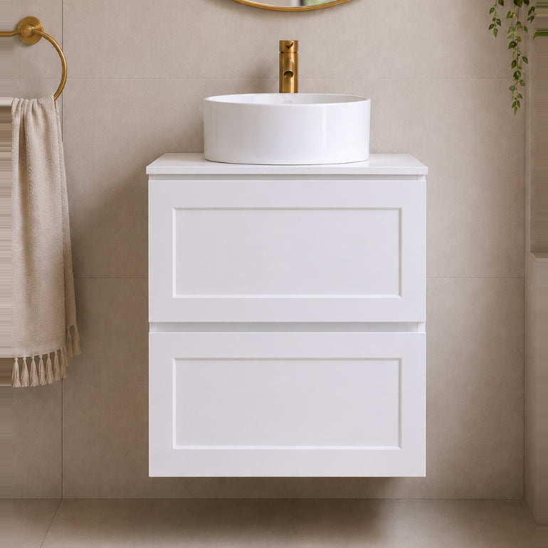 Shaker White vanity with round sink and gold faucet in a bathroom setting.