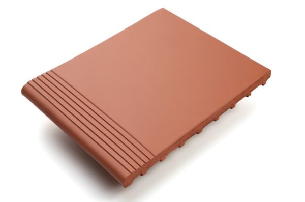 Caldria Red Terracotta matt terracotta step tread with integrated linear tread detailing, shown in a warm red terracotta colour.