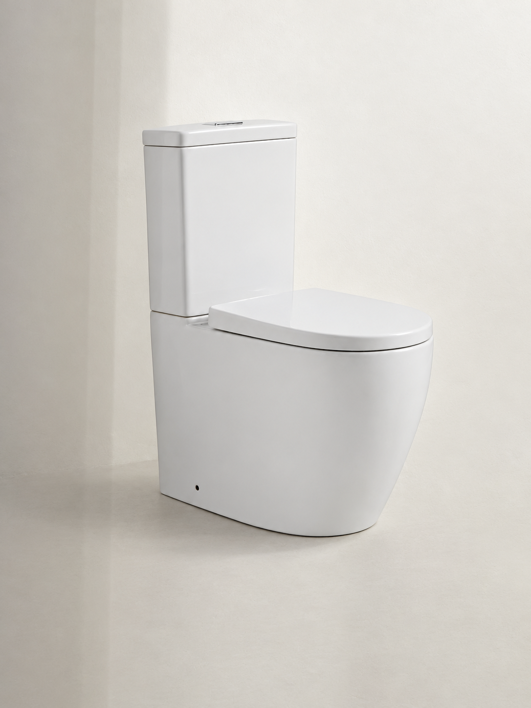 Purava rimless back to wall toilet suite in gloss white, featuring a modern curved pan, close-coupled cistern and dual flush button.