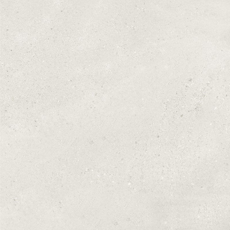 Solmara Bianco matt porcelain tile, 300 x 600 mm, featuring a light off-white surface with fine grey speckling and subtle tonal variations.