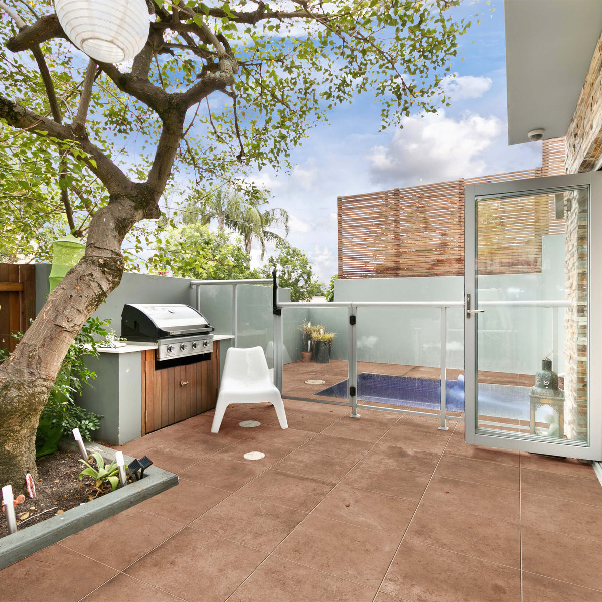 Virello red terracotta matt tile, 300 x 300 mm, featuring a warm earthy colour and a square format.